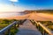 Wooden walkway to the beach Praia da Amoreira, District Aljezur, Algarve Portugal. Panorama from Amoreira beach in the Algarve