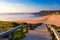 Wooden walkway to the beach Praia da Amoreira, District Aljezur, Algarve Portugal. Panorama from Amoreira beach in the Algarve