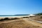 Wooden walkway to the beautiful wild beach Playa de Bolonia on the Atlantic coast of Tarifa.