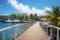 Wooden walkway to the marina with palm trees and boats, Promenade at marina of Bridgetown, Barbados, AI Generated
