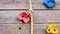 Wooden wall for climbing with plastic grip handles and ropes on playground