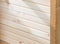 Wooden wall made of new polished light clapboard, construction concept and texture of wooden lumber
