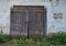 Wooden warehoese door in old brick building
