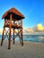 Wooden watchtower on the empty beach at sunset, Cancun, Mexico