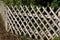 Wooden wattle fence in a garden