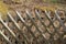 Wooden wattle fence in a garden near a rural house