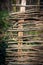 Wooden wattle fense in autumn garden