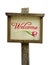 Wooden welcome sign with a tulip