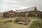 Wooden well outside barn in field, Bodie