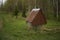 Wooden well water background summer forest.