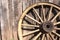 Wooden wheel against barn