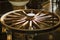 Wooden wheel converted into a chandelier