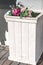 Wooden white planter standing outdoor