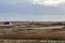 Wooden windmill in a deserted field, old windmill in authentic landscape of island of the Ouessant, Brittany, Finistere, France