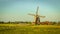 Wooden windmill with miller house vintage look