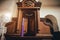 Wooden window of confessional box at church