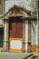 Wooden window on facade of old colorful house