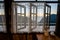 Wooden windows with white curtains, mountain view with rising sun light in the morning