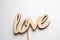 Wooden word love on white background, for holiday decoration, template for design