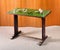 Wooden writing desk with green top surface
