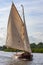 Wooden yacht sailing on the Norfolk Broads - England