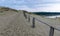 Wooden yard, sand dune view, poor plants