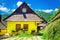 Wooden yellow hut in traditional village, Slovakia