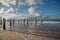 Woodenpoles at the beach near Petten aan Zee, Holland