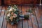 Woodland elegance close up of rustic bouquet on wooden floor