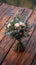 Woodland elegance close up of rustic bouquet on wooden floor