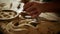 Woodmaker using tools indoors. Unknown man carving wood in carpentry workshop