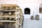 Woodpile against the background of a Russian bleached stove