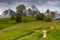 Woodshed among trees on a hill by the road in High Tatras