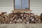 Woodstack under window on verandah