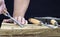 Woodworker carves wood pieces. Hands doing wood carving.Handicrafts.A woodcarver processes a wood board with a chisel