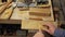 Woodworker inserts wooden beard comb into wooden pattern. handmade. 4k