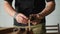 A woodworker makes the markings on the oak blank using marking gauge. handmade carpentry. the sound of carpentry tools