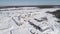 Woodworking enterprise and finished goods warehouse view from the quadrocopter from above in winter