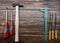 Woodworking tools: hammer, screwdrivers, wood files, gauge, isolated on wood background. Top view. Flat lay
