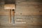 Woodworking word with mallet and chisel on wooden workbench, top