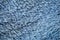 Wool background. Detail of artificial fur, blue sheepskin rug background