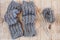 Wool grey legwarmers, knitting needles and yarn