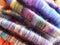 Woolen multi-colored handmade yarn in rolls.