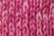 Woolen texture background, knitted wool fabric, pink hairy fluff