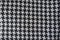 woollen fabric with crow`s feet pattern in black and white