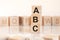 Word abc from wooden blocks with letters, concept