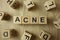 Word acne from wooden blocks