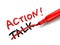 The word action with a red marker
