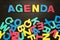 The word agenda written with colored letters