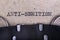 The word anti-semitism written in typewriter font. The inscription in the old style on gray paper